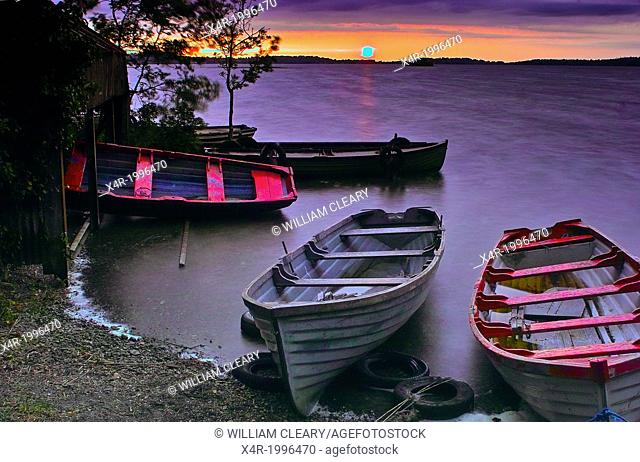 Sunset over Lough Owel, with moored boats in the foreground, near Mullingar, County Westmeath, Ireland