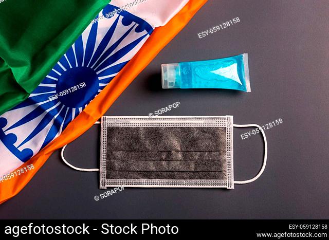 Medical protective disposable face mask for cover mouth with India flag, studio shot on gray background, Safety healthcare medical prevent coronavirus or...