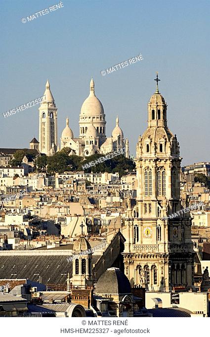 France, Paris, overview of Basilique du Sacre Cœur Sacred Heart Basilica and the Sainte Trinite Holy Trinity Church