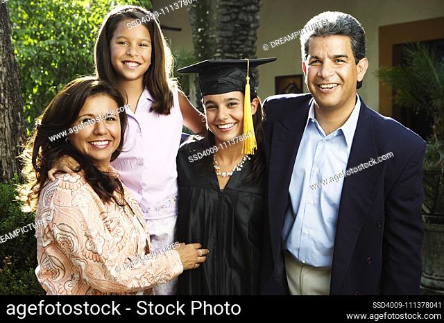 Graduate and family smiling for the camera