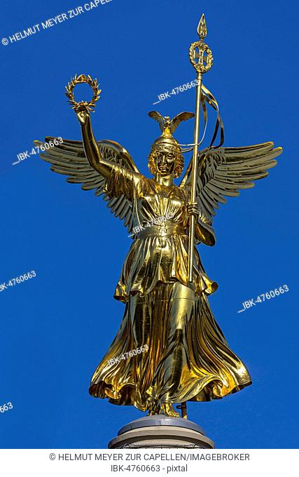 Bronze sculpture of Victoria on the Victory Column, inaugurated in 1873, blue sky, Berlin, Germany