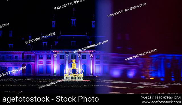 16 November 2023, Saxony, Dresden: A crown, the pleasure garden and the Bergpalais are illuminated for the opening of the ""Christmas Garden"" light magic in...