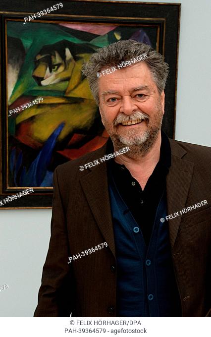 Museum director Helmut Friedel poses in front of the painting 'Tiger' by Franz Marc in the new Lenbachhaus in Munich, Germany, 06 May 2013