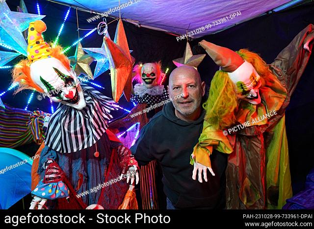 PRODUCTION - 26 October 2023, Schleswig-Holstein, Lübeck: Patric Nonnweiler stands in a party tent on the driveway of his house in the Kücknitz district among...
