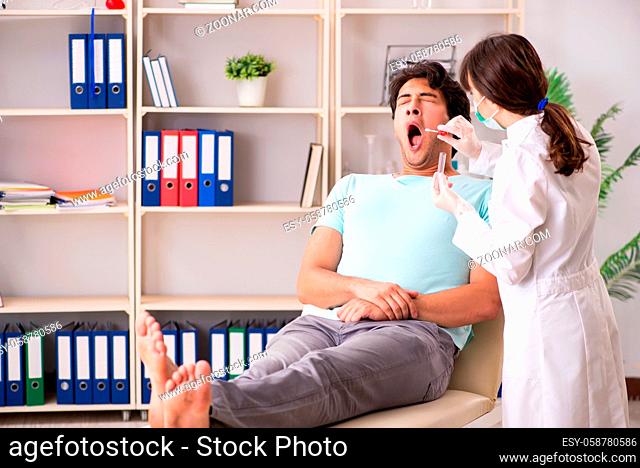 Doctor getting saliva test sample in clinic hospital