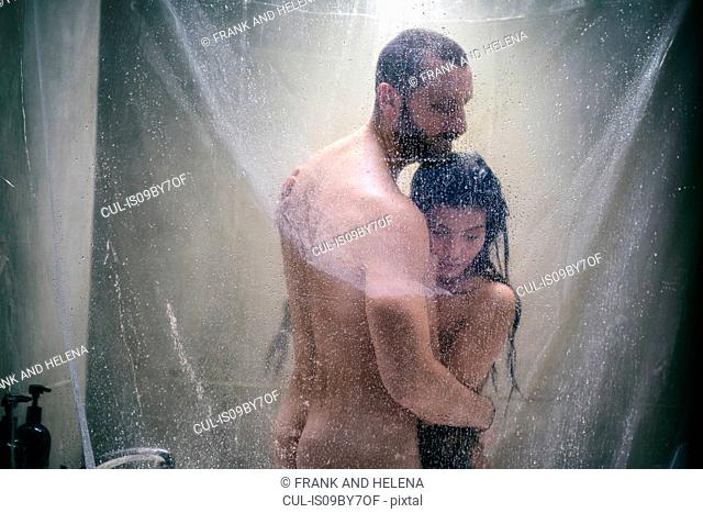 Naked hipster couple in shower