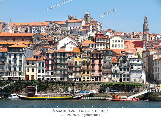 Oporto or Porto city skyline, Douro river, traditional boats and Dom Luis or Luiz iron bridge. Portugal, Europe