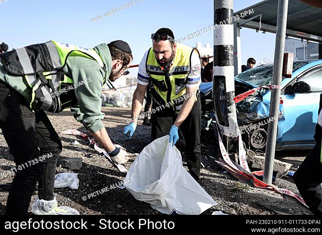 10 February 2023, Israel, Jerusalem: Israeli emergency responders work on a scene of an accident in which two people were killed, one of whom is a child
