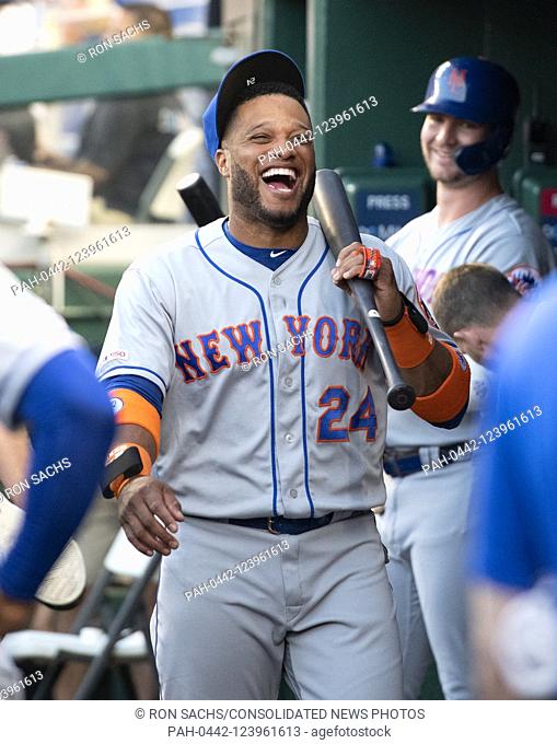 New York Mets infielder Robinson Cano (24) smiles in the dugout prior to the game against the Washington Nationals at Nationals Park in Washington, D