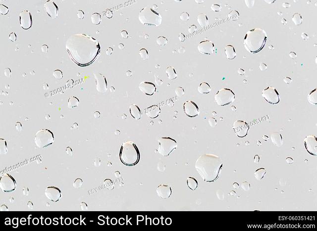 close up droplets white surface