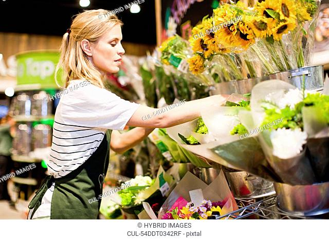 Grocer working in florist section