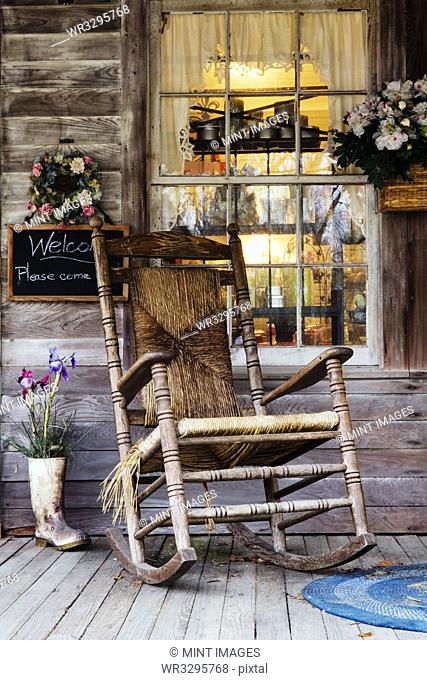 Old Wooden Rocking Chair on a Wooden Porch