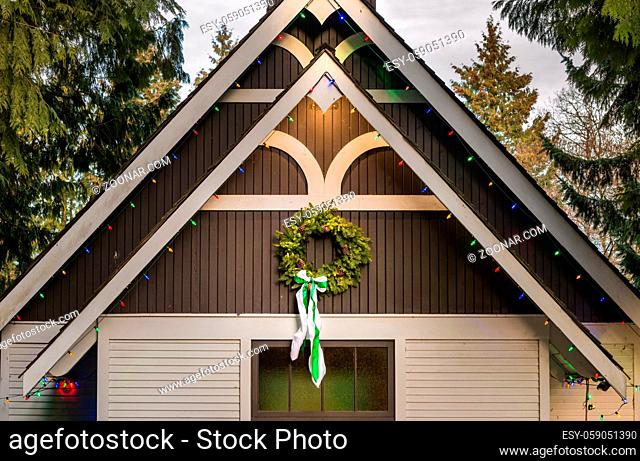 1920's style Christian wooden church with traditional evergreen wreath. Burnaby Village Museum during annual Heritage Christmas event