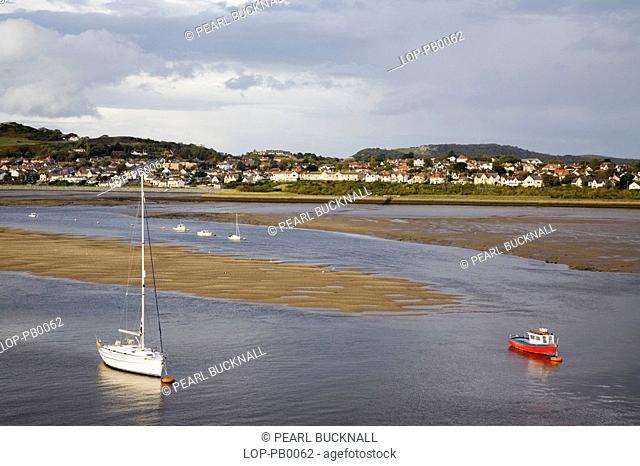 View across river estuary toward Deganwy. Conwy is the only town in Wales that still has a complete circuit of town walls and in Britain