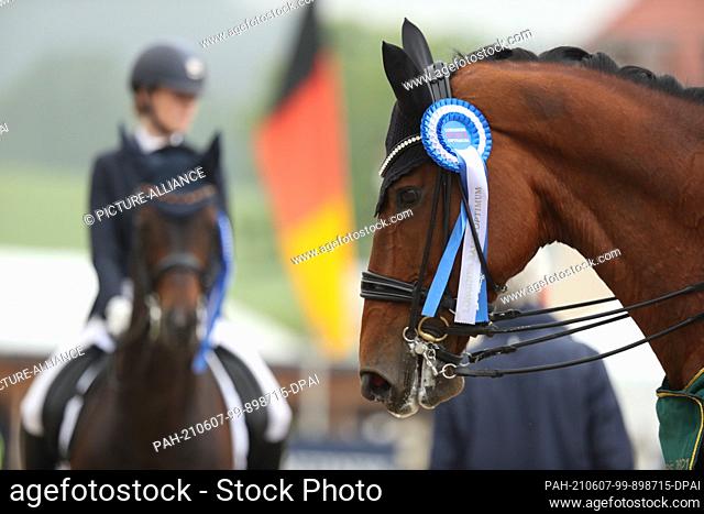 06 June 2021, North Rhine-Westphalia, Balve: Equestrian sport: German Championship U25, Dressage. The dressage rider Ellen Richter wins on Vinay in the Grand...