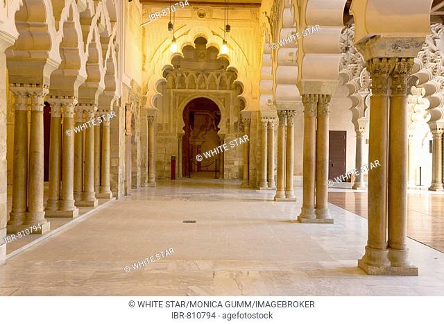 Ornate stone carved arched passageway of the Santa Isabel Patio, Palacio de Aljaferia palace, Moorish architecture, Zaragoza, Saragossa, Aragon, Spain