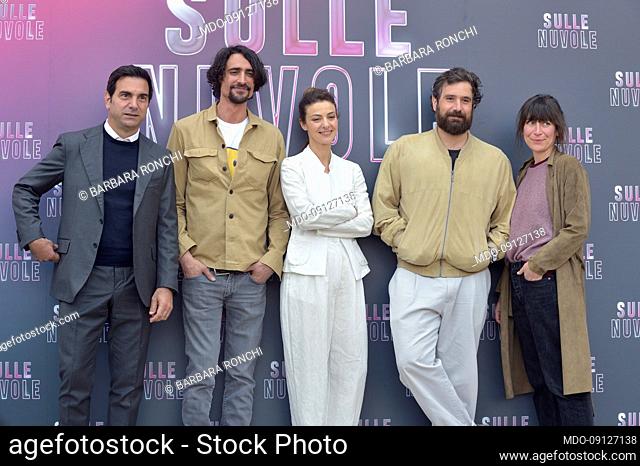 Marco Cocci, Barbara Ronchi and director Tommaso Paradiso with film producers attends the photocall of the movie Sulle Nuvole at The Space Cinema Moderno