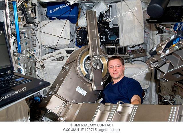 NASA astronaut Doug Wheelock, Expedition 24 flight engineer, works with Muscle Atrophy Resistive Exercise System (MARES) hardware during installation of MARES...