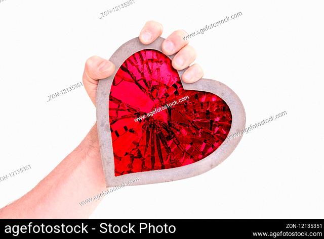 Adult holding heart filled with a large red ruby - Isolated on white