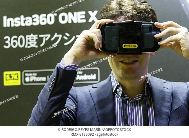 November 15, 2018, Tokyo, Japan - A man enjoys using VR glasses during the International Broadcast Equipment Exhibition (Inter BEE) 2018 at the International...