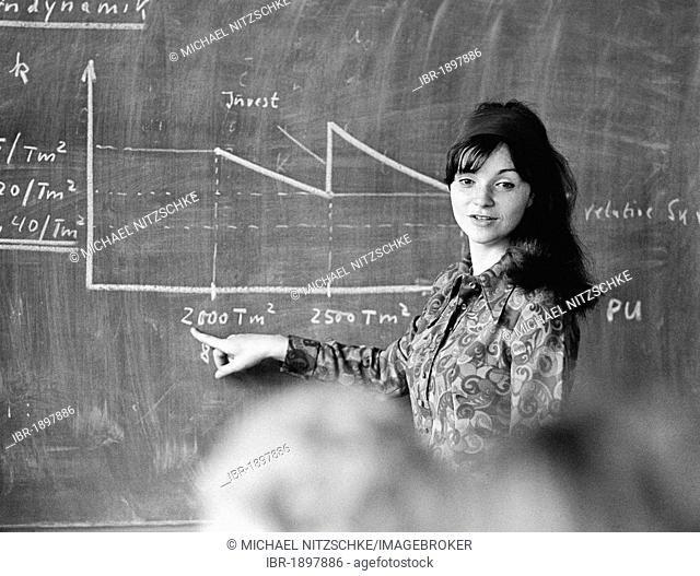 Young woman, student at the blackboard, Leipzig, East Germany, historical photograph around 1978