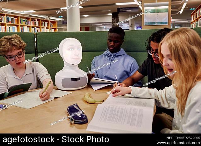 Friends sitting together in library