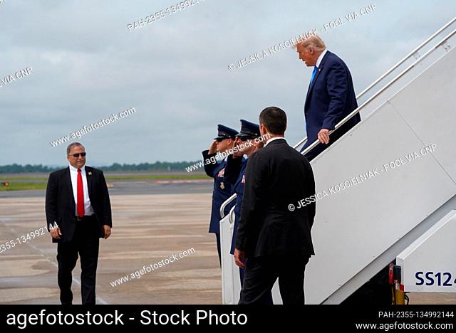 President Donald Trump departs Air Force One after arriving in Charlotte, N.C. Monday, Aug. 24, 2020. He is expected to speak at the Republican National...