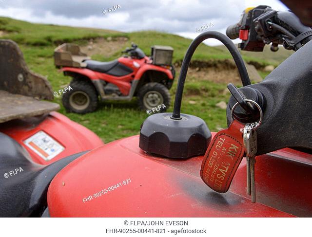 Close-up of keys in Honda quadbike on farm, Chipping, Lancashire, England, August