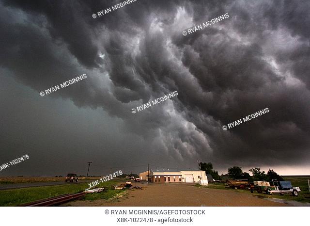 Roiling outflow clouds behind a supercellular thunderstorm producing a tornado near Quinter, Kansas, May 23, 2008