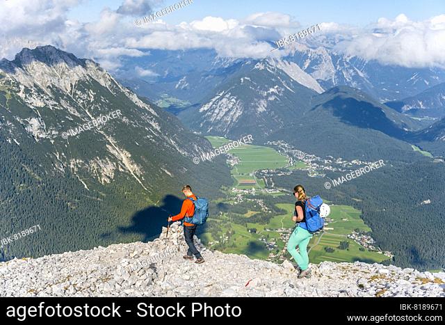 Hiker in front of mountain landscape, ridge walk, Hohe Munde, Mieminger Gebirge, Tyrol, Austria, Europe