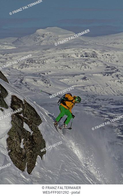 Sweden, Skier skiing steep downhill