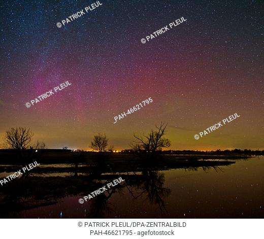 A polar light shines at the nightsky above Guelper Havel river in Guelpe, Germany, 23 February 2014. These Northern Lights are caused by a giant cloud of...