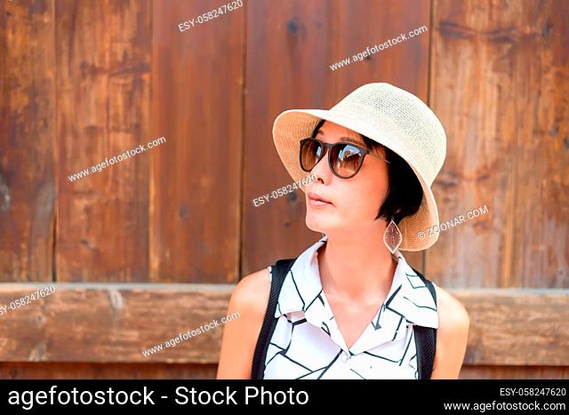 traveling Asian woman walking in the old street at Lukang town at Changhua county, Taiwan, Asia