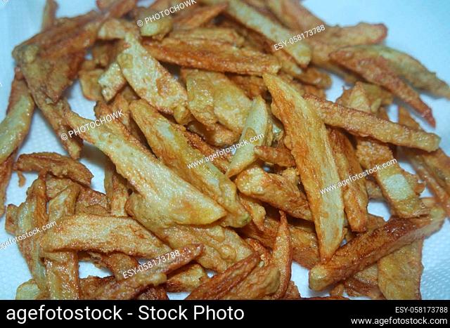 Potato fried or roasted slices on clean background with copy space for text