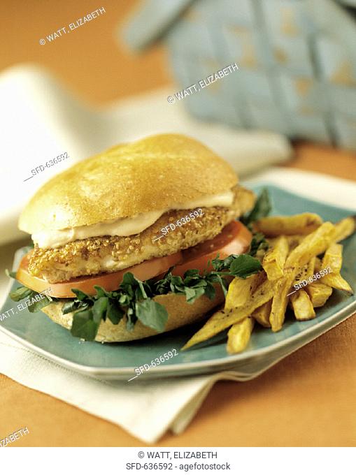 Chicken Filet Sandwich on a Hard Roll with Tomatoes, Watercress and French Fries