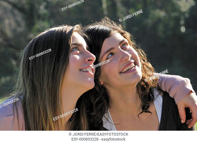 Two teenage girls looking ahead