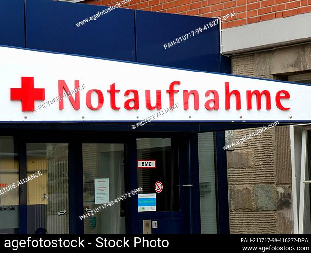 05 July 2021, North Rhine-Westphalia, Cologne: A sign reading ""Emergency Room"" with a red cross hangs at the entrance to a hospital