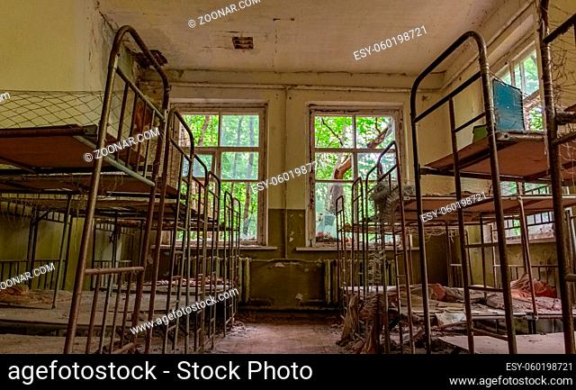 A picture of bunk beds inside an abandoned kindergarten near Chernobyl