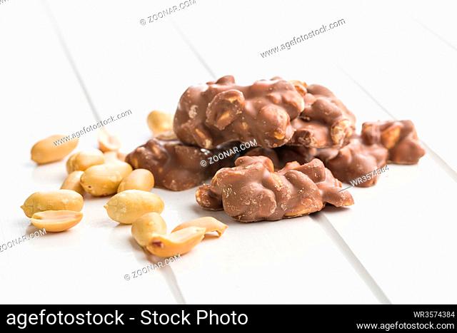 Peanuts covered chocolate. Tasty sweet chocolate truffles