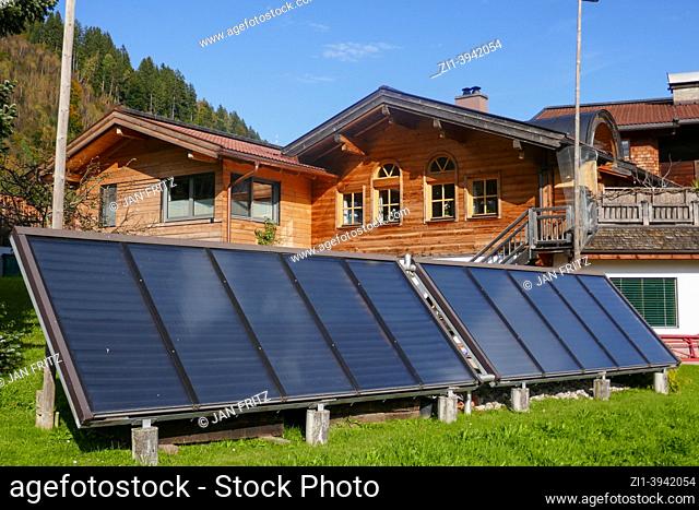 sunpanels and wooden farm in national park Hohe Tauern, Austria