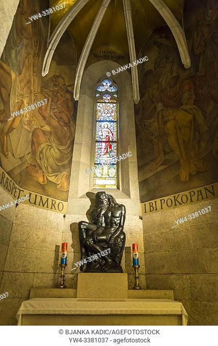 Side altar with Pieta sculpture by the Croatian sculptor Ivan Mestrovic, Interior of St Mark's Church, Upper Town, Zagreb, Croatia