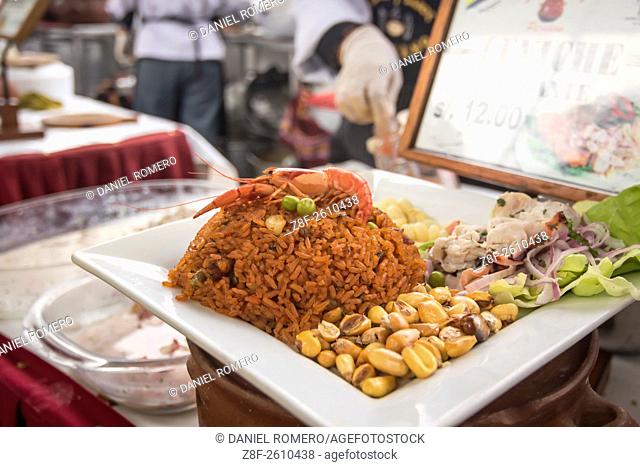Peruvian food dishes: ""Arroz con mariscos y Ceviche"". Peruvian seasoning and flavor, food fair. La Limeñita boulevard, Camana Street