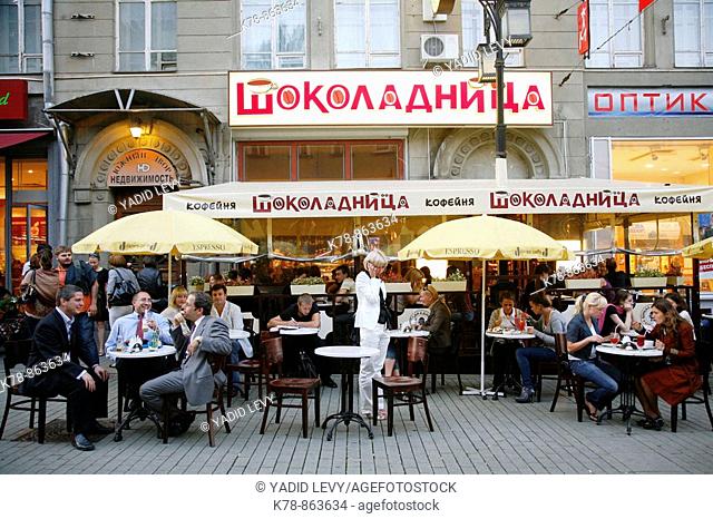 Sep 2008 - People sitting at outdoors cafe on Kamergersky pereulok Street next to Tverskaya Ulitsa street, Moscow, Russia