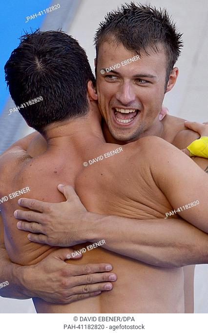 Gold medalists Patrick Hausding (L) and Sascha Klein of Germany celebrate after the men's 10m Synchro Platform diving final of the 15th FINA Swimming World...