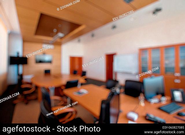 Businessmen blur in the workplace.Table Top And Blur Office of Background.abstract blur background table work in office with computer