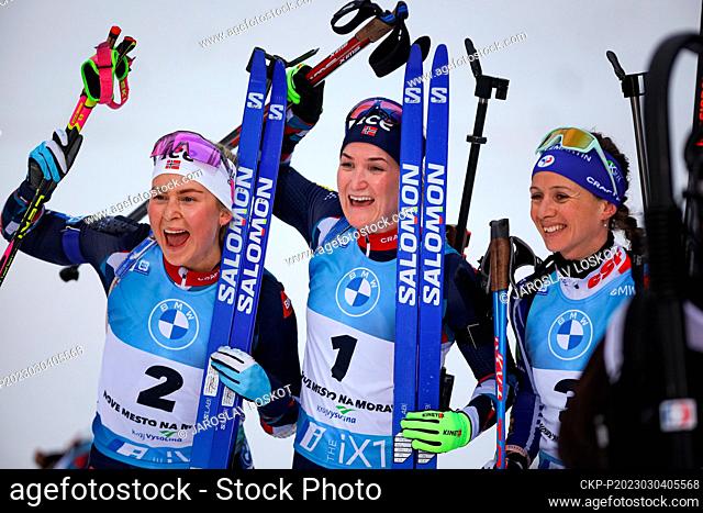 (L-R) Second placed Ingrid Landmark Tandrevold, winner Marte Olsbu Roeiseland of Norway and Anais Chevalier-Bouchet of France after the women's Biathlon World...