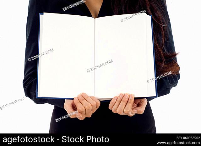 Female hands holding a blank book isolated over white background