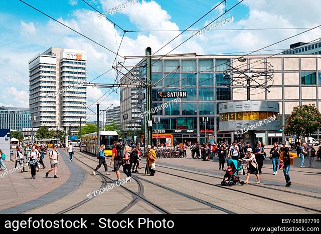 Berlin, Germany - May, 2019: People on crowded street at Alexanderplatz square in Berlin city Center