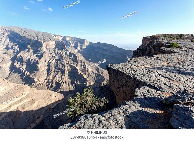 Edge of Wadi Ghul, also known as Grand Canyon of Oman. Jebel Akhdar mountains in Oman, Middle East