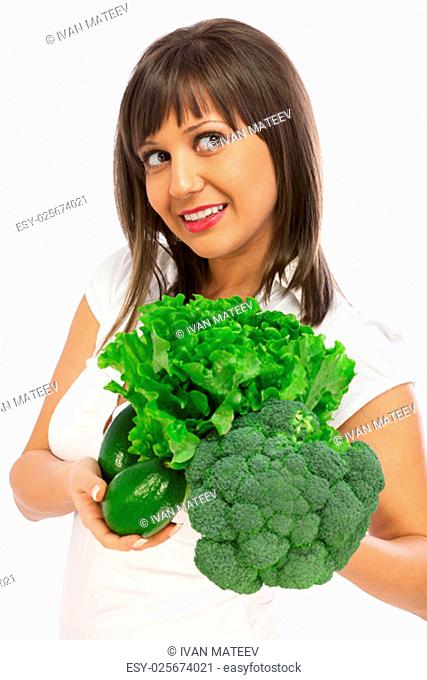 Young woman holding broccoli ald lettuce isolated on white background